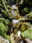 The water cascades from the water hole spring