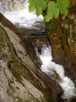 The water cascades from the water hole spring