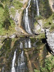 The water cascades from the water hole spring